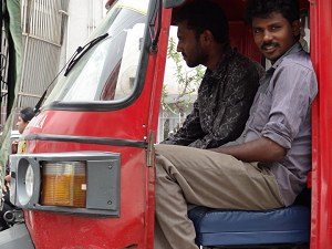 Men in an autorickshaw image
