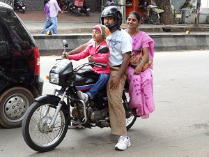 Family going to church on a motor cycle image