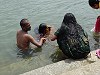 Bathing in the Cauvery river at Nimishamba temple