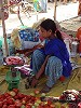 Girl weighing fruit